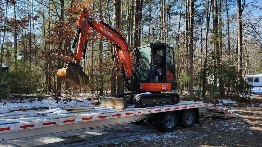 Machinery arrives to begin Foundation digging for New Master Bath Addition