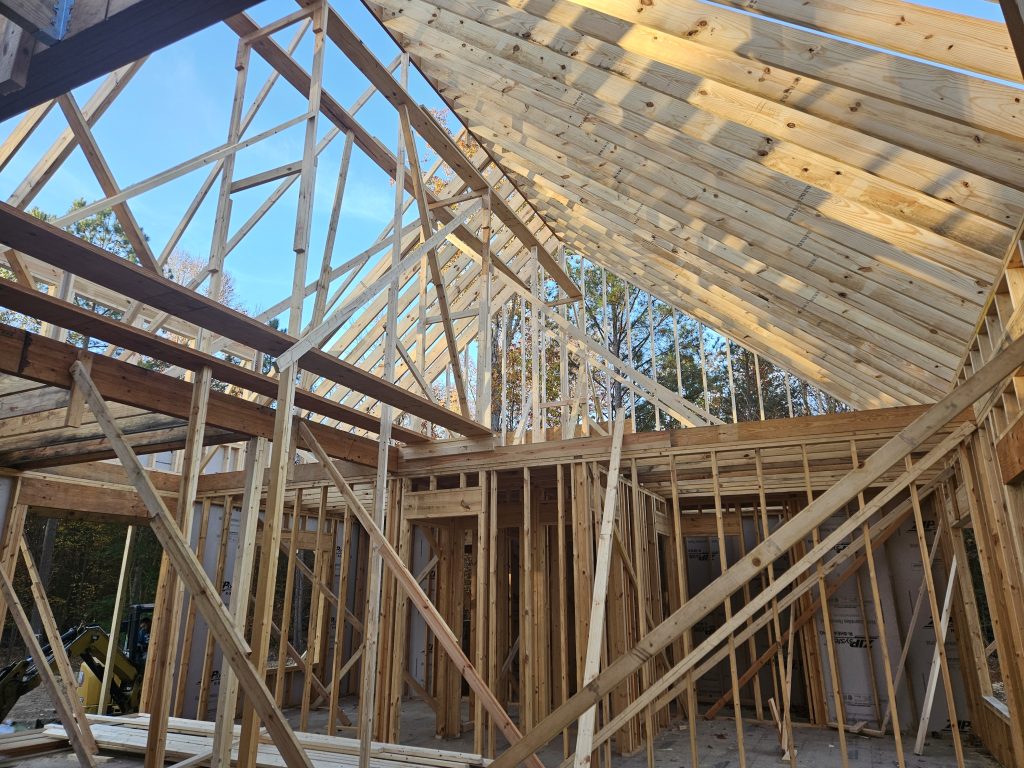Builder shows Roof Framing from interior of New Home Build