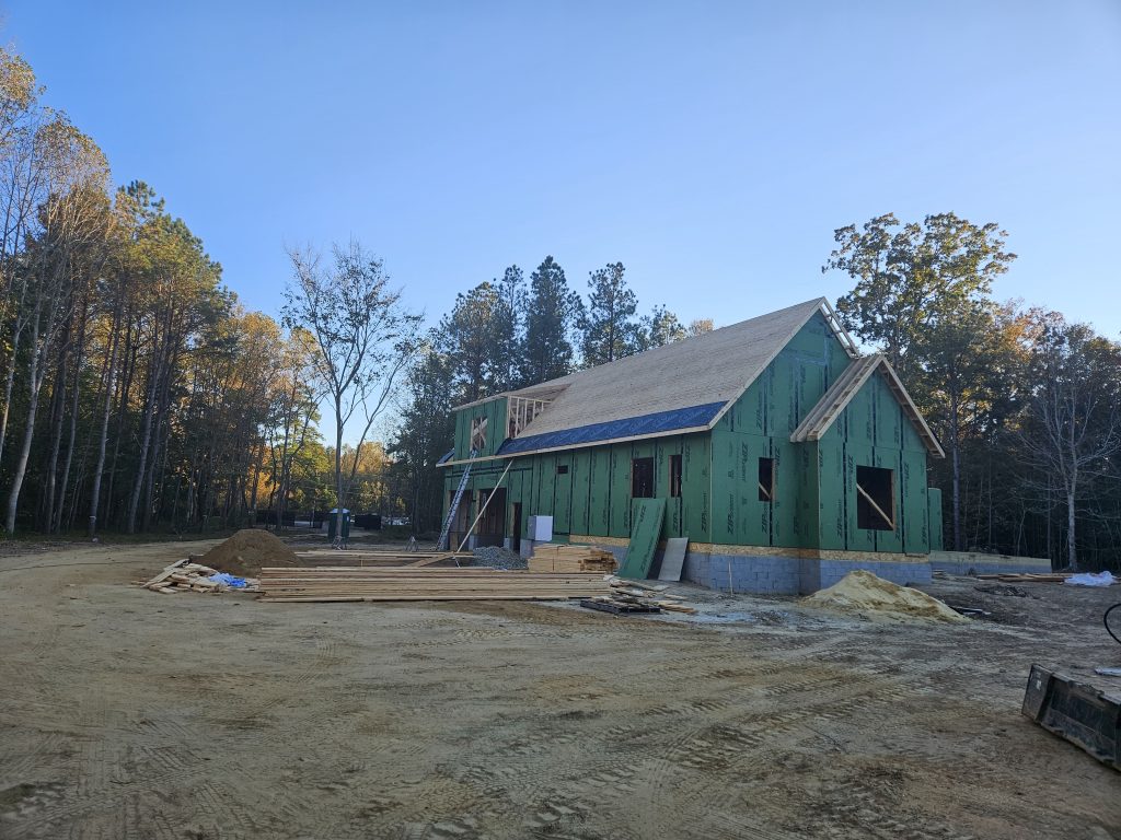 Builder shows Roof Sheathing being installed