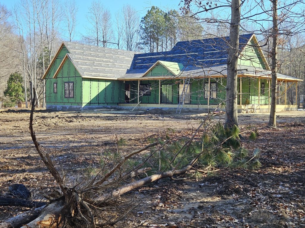 Builder shows backside of framing completed for New Home Build