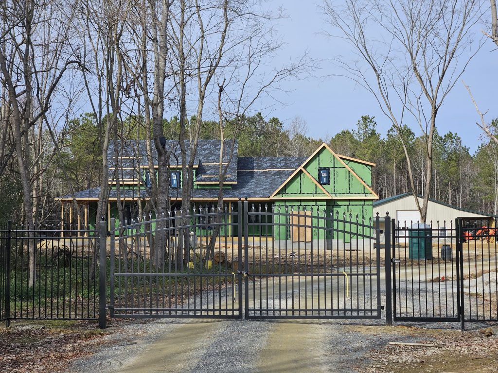 Builder shows progress of New Home Build through the gate