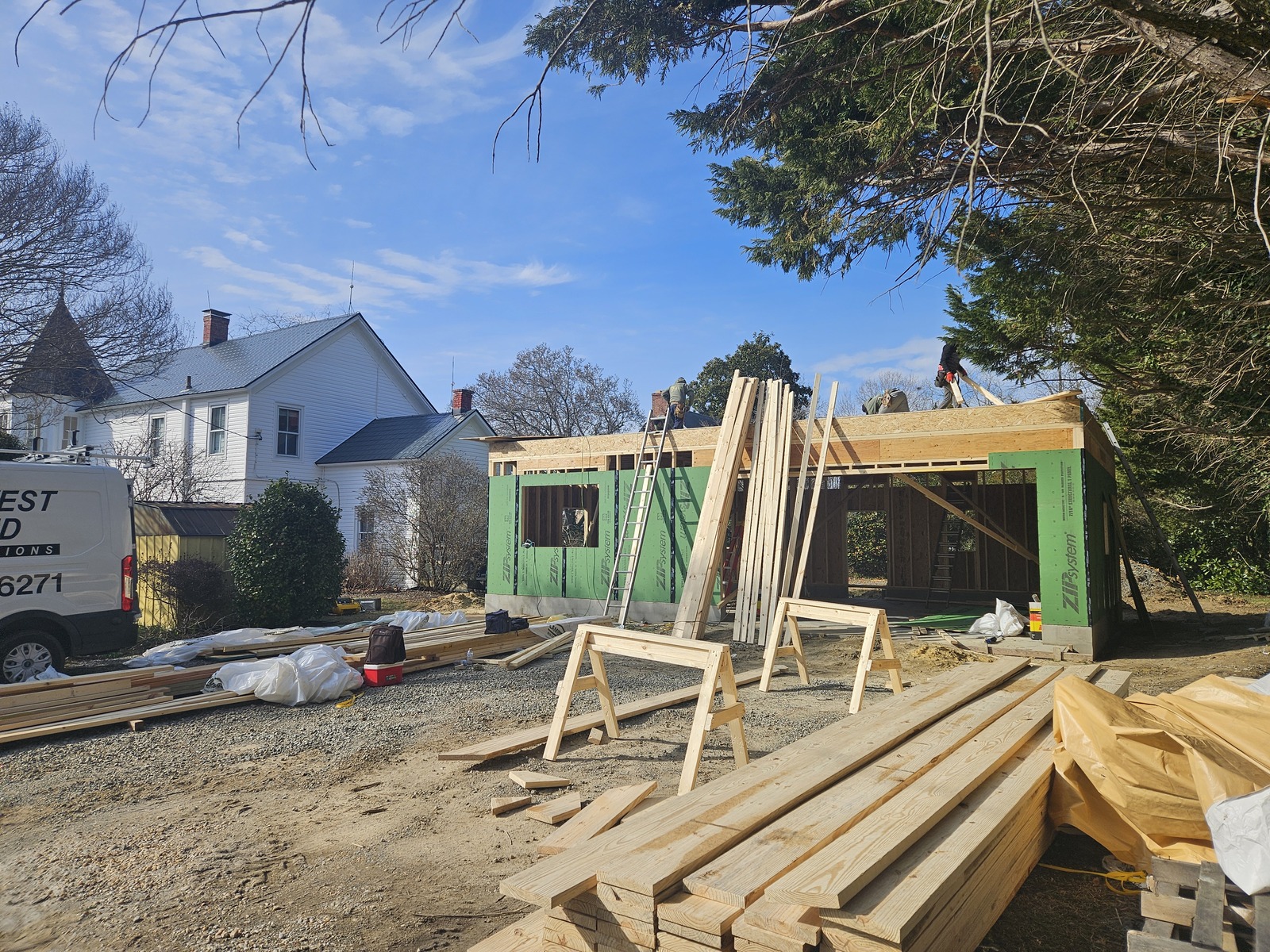 Preparing to install the roof after the first floor was framed