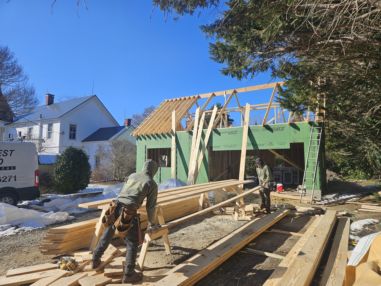 Roof framing being installed while creating the second story storage area