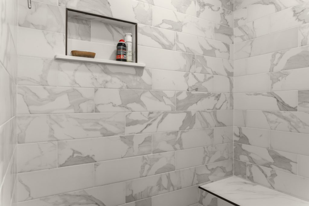 Bathroom Remodeler shows Porcelain Tile in Shower