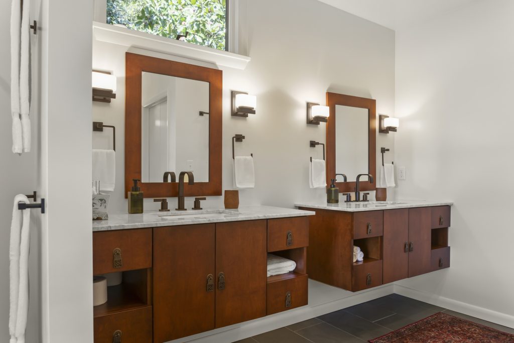 Bathroom Remodeler shows floating vanities in maple wood