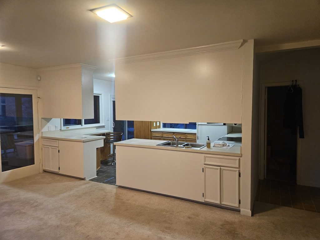 Before Kitchen Remodeler with cabinets blocking room from outside