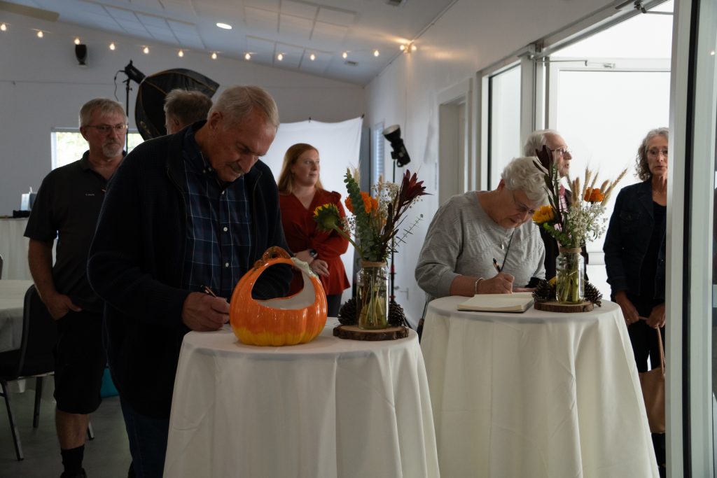Customer signing guest book