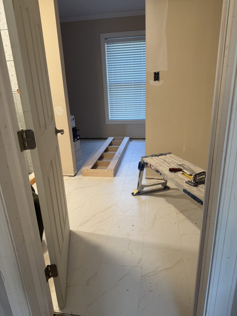 Creating a new bathroom entrance with new flooring throughout