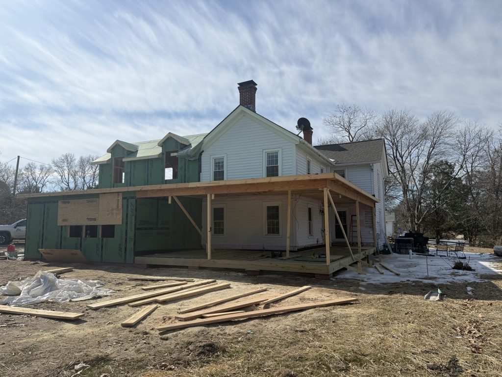 Wrap around porch shows construction of Home Remodel and Addition